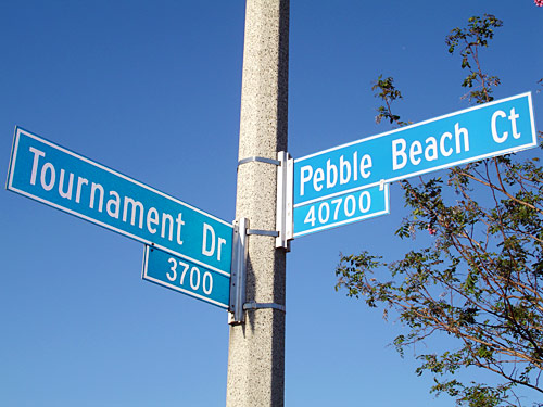 Los Angeles County street sign pole mounted with stainless banding
